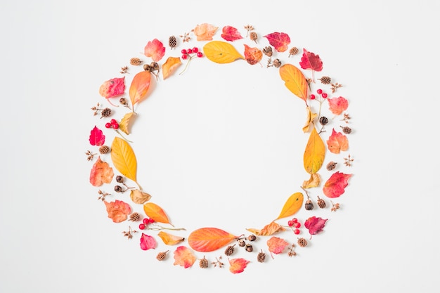 Free photo flat lay autumn leaves double frame