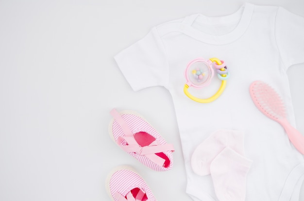 Flat lay baby clothes with white background