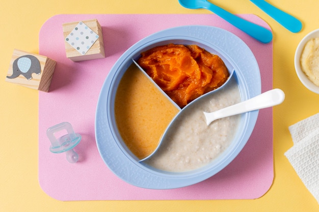 Flat lay baby food with spoon