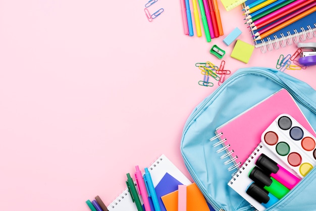 Free photo flat lay of back to school stationery with backpack and copy space