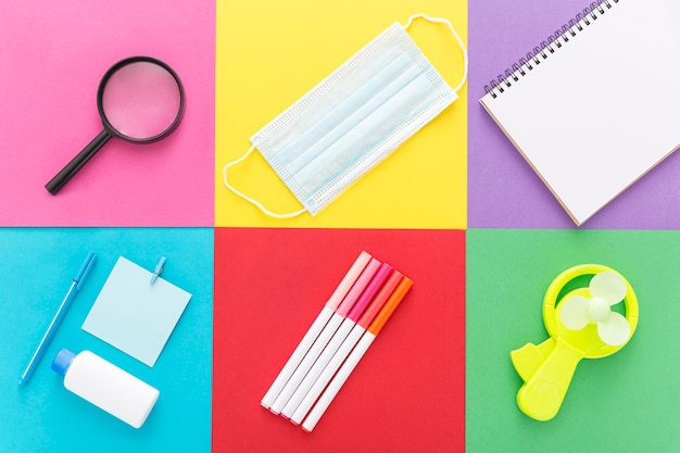 Flat lay of back to school supplies with pencils and notebook