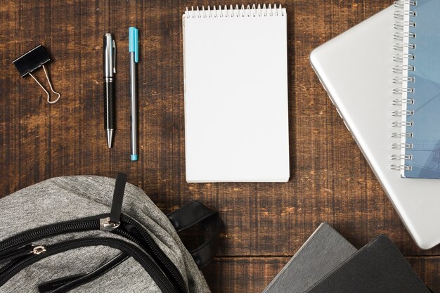 Flat lay backpack and school supplies