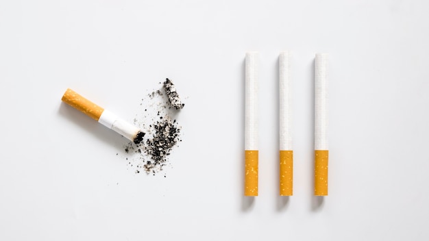 Flat lay of bad habit cigarette arrangement