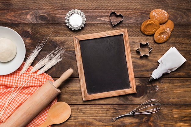 Free photo flat lay bakery composition with slate template