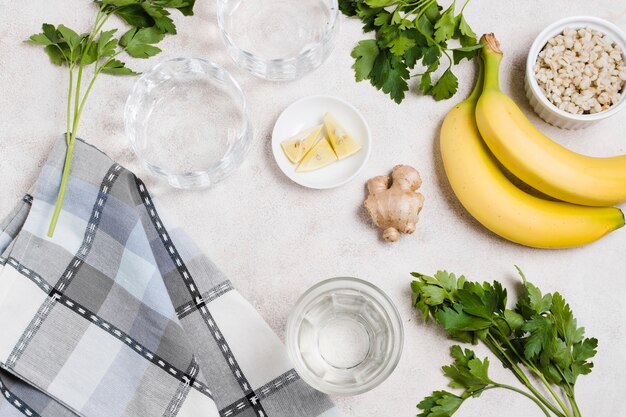 Flat lay of banana and ginger with lemon