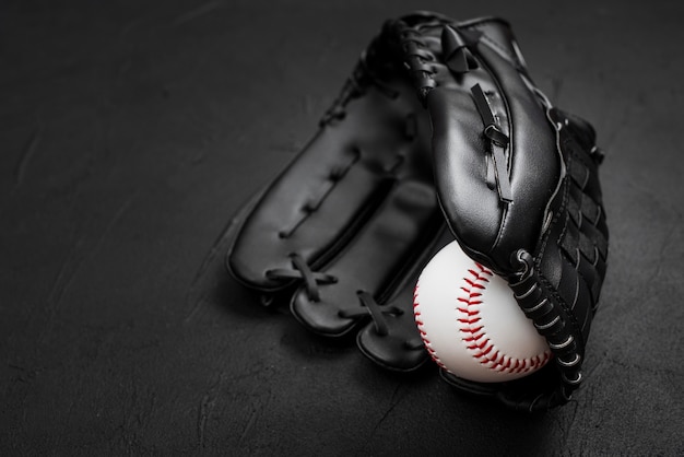 Flat lay of baseball inside glove