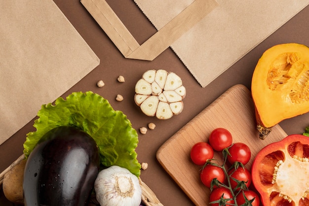 Flat lay of basket of organic vegetables with paper bag