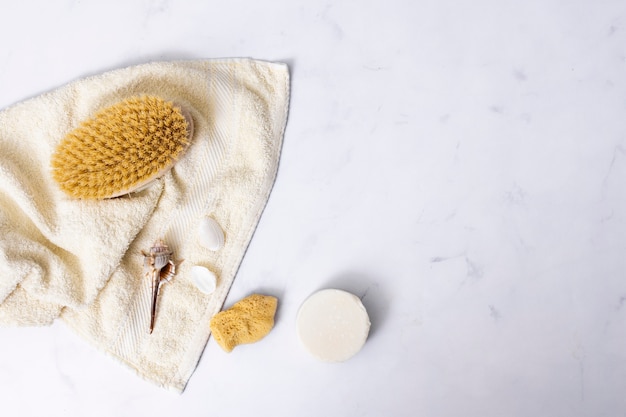 Flat lay bath concept on marble background with copy-space