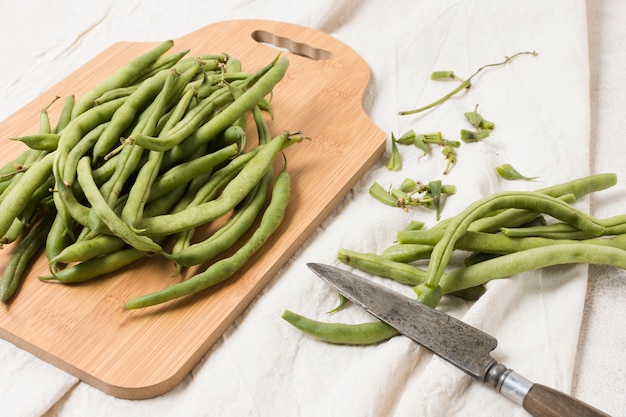 Flat lay of beans on chopping board
