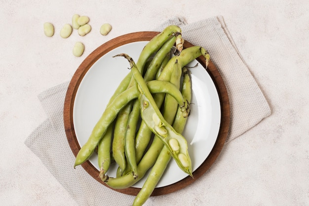 Flat lay of beans and garlic on plate