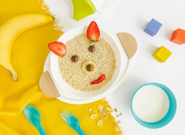 Flat lay bear shape cereals with milk