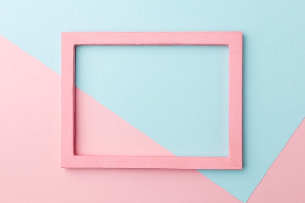 Flat lay of beautiful pink wooden frame concept