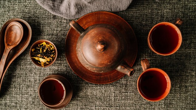 Flat lay beautiful set of teapot and cups