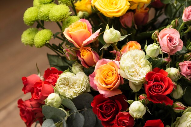 Flat lay of beautifully bloomed colorful rose flowers