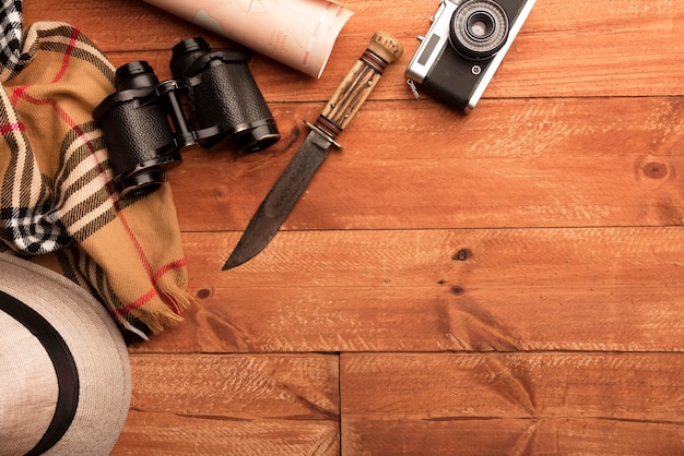 Flat lay binoculars and knife frame