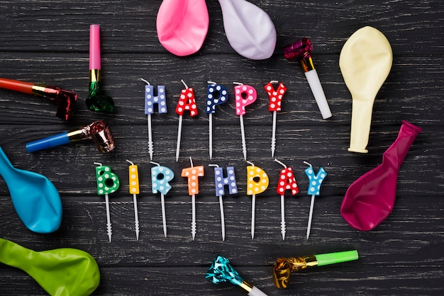 Flat lay birthday candles on wooden background