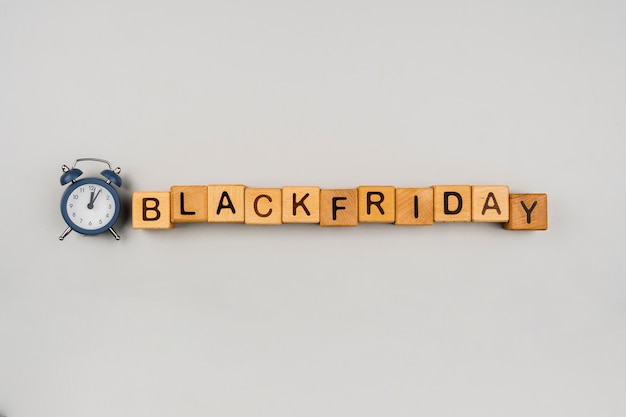 Flat lay of black friday cubes on plain background