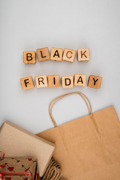 Flat lay of black friday word on plain background