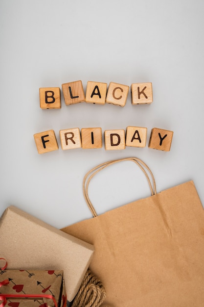 Flat lay of black friday word on plain background