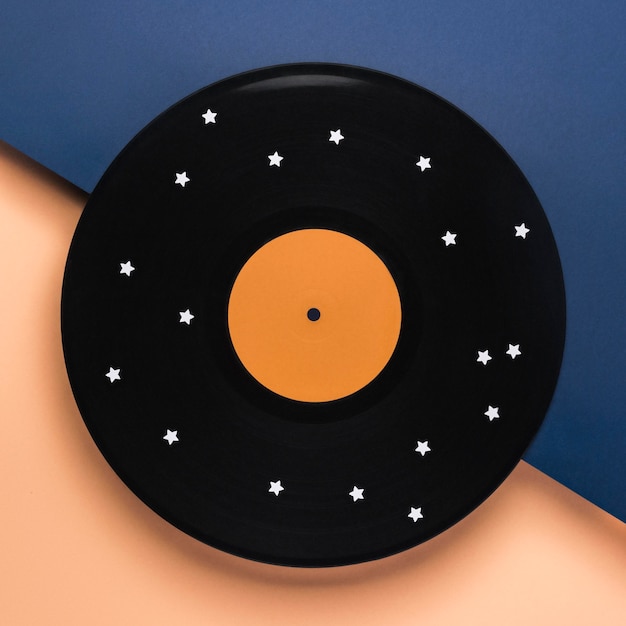 Flat lay black vinyl composition with white stars