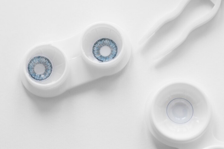 Free Photo flat lay blue contacts
