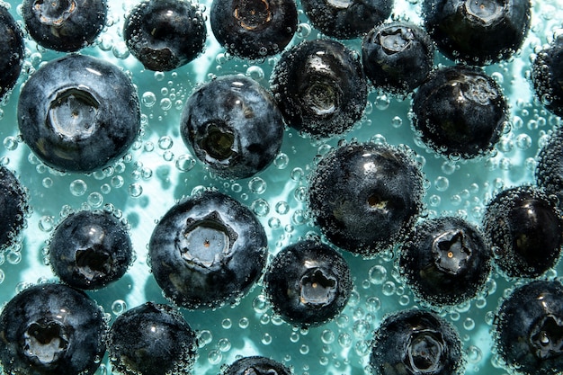 Flat lay blueberries with sparkling water