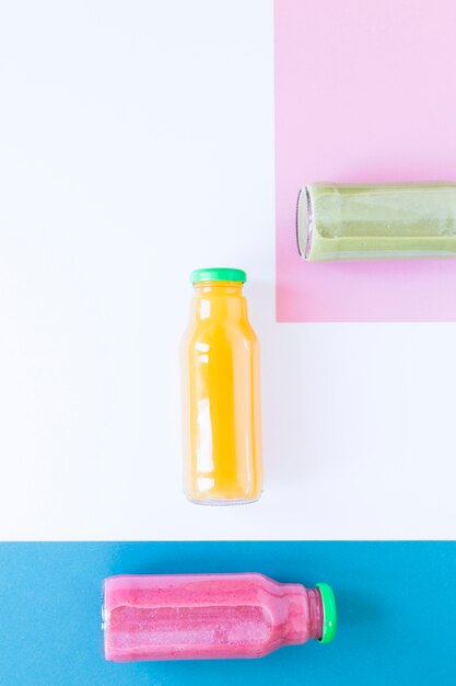 Flat lay bottles with smoothie