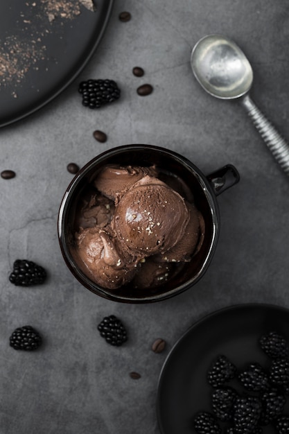 Free photo flat lay bowl with chocolate flavored ice cream