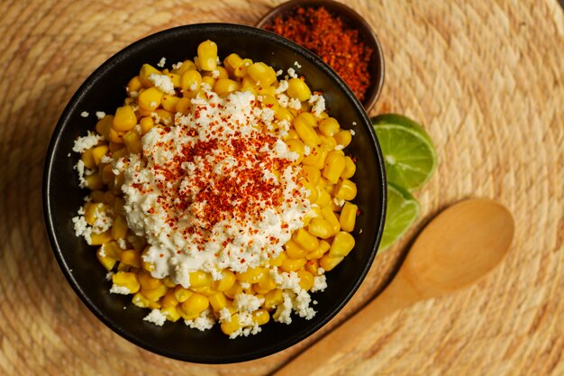 Flat lay bowl with delicious esquites