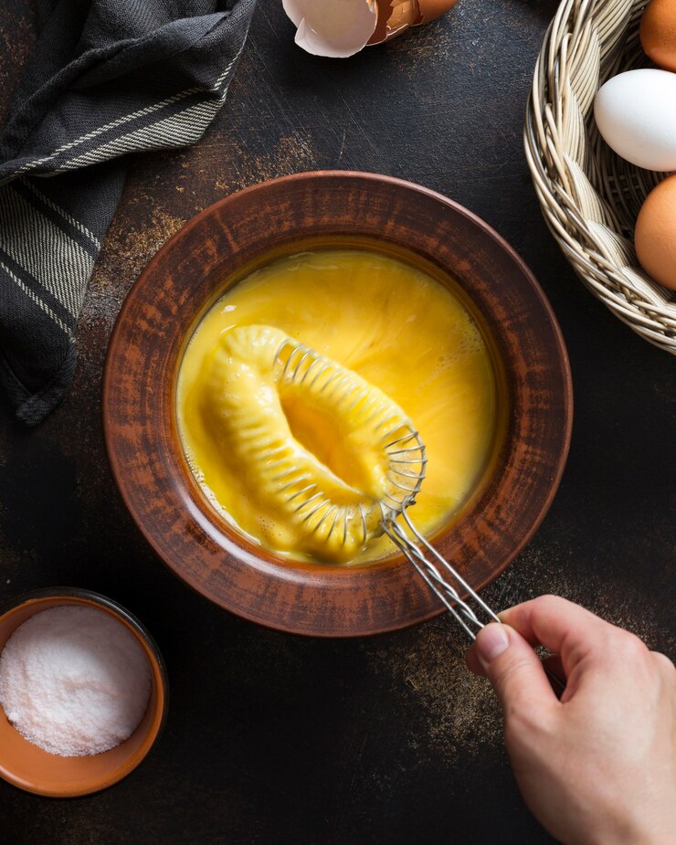Free Photo flat lay bowl with eggs yolk