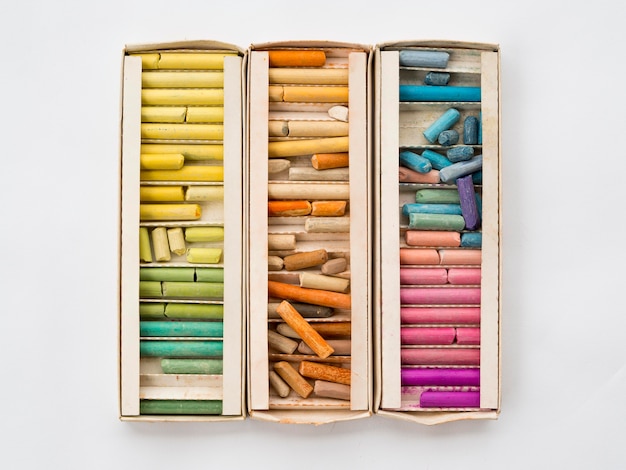 Flat lay of box with colorful chalk