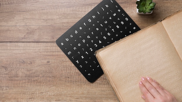 Free photo flat lay braille alphabet board