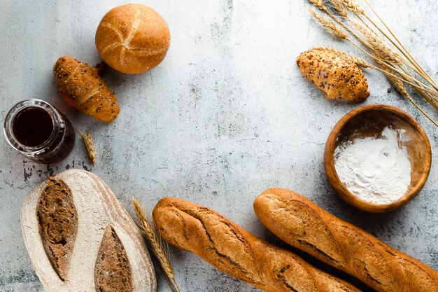 Flat lay of bread and croissants with copy space