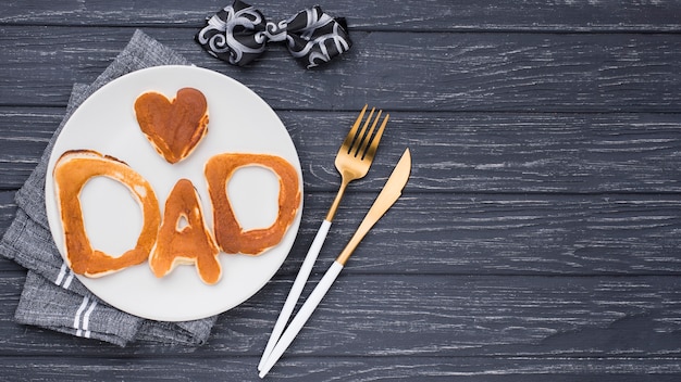 Free photo flat lay bread letters for father's day