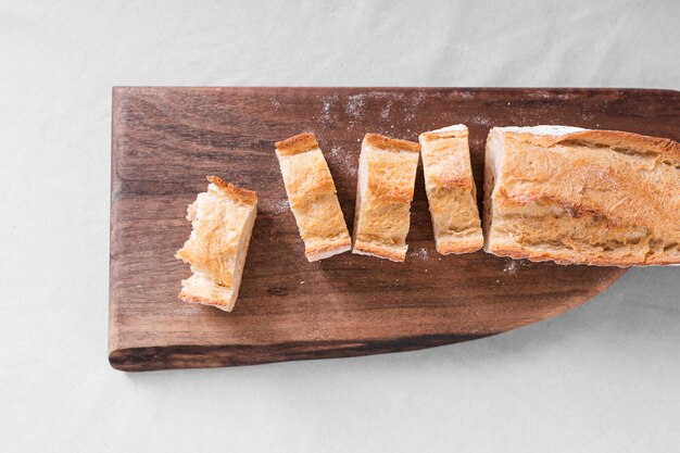 Flat lay bread with wooden cutting board