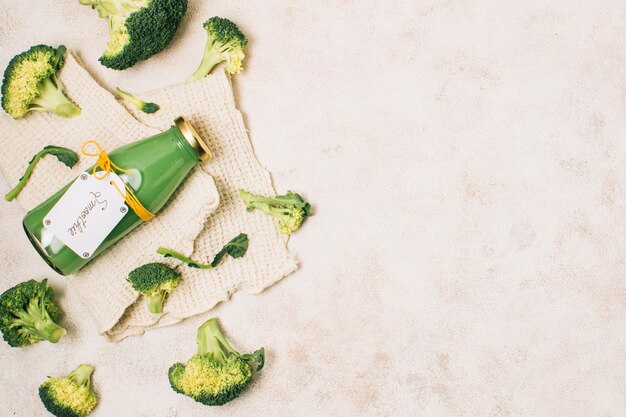 Flat lay broccoli smoothie with copy space