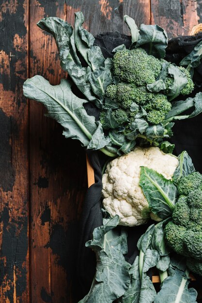 Flat lay broccoli with leaves in a basket