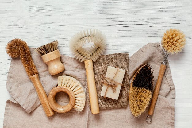 Flat lay brushes on wooden table