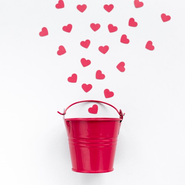 Flat lay of bucket with hearts