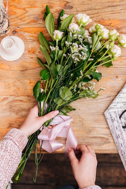 Flat lay bunch of flowers with ribbon