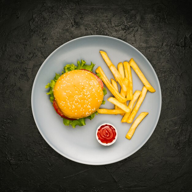 Flat-lay burger and fries on plate