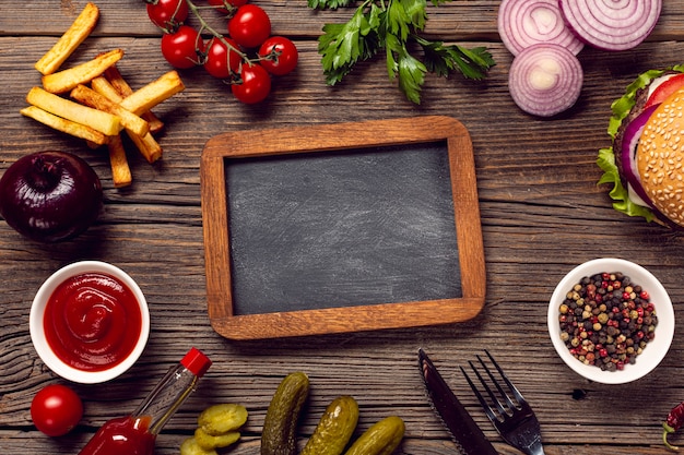 Flat lay burger ingredients with chalkboard