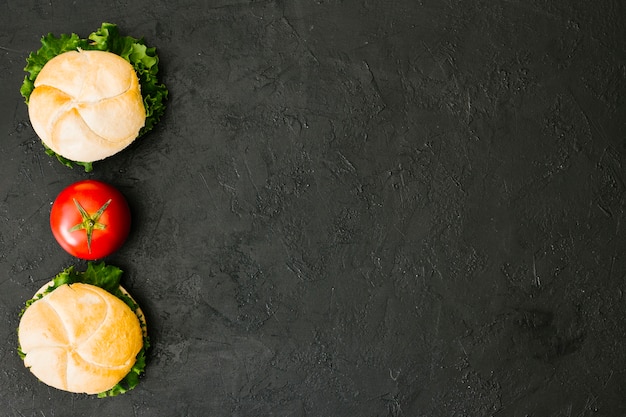 Flat-lay burger on slate with copyspace