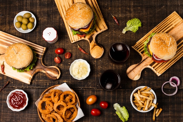 Free photo flat lay of burgers and onion rings