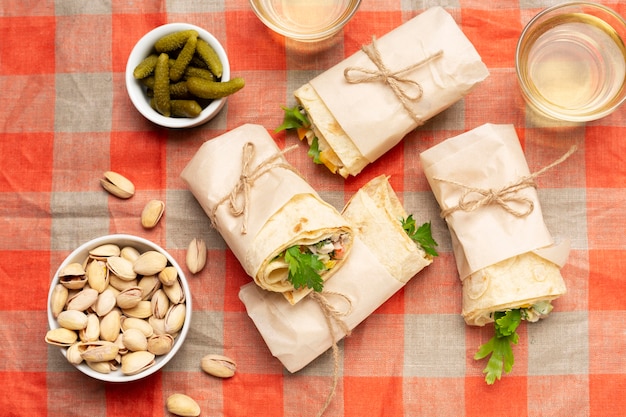 Free photo flat lay burritos on tablecloth