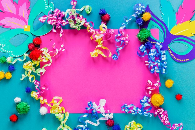 Flat lay of carnival masks and confetti