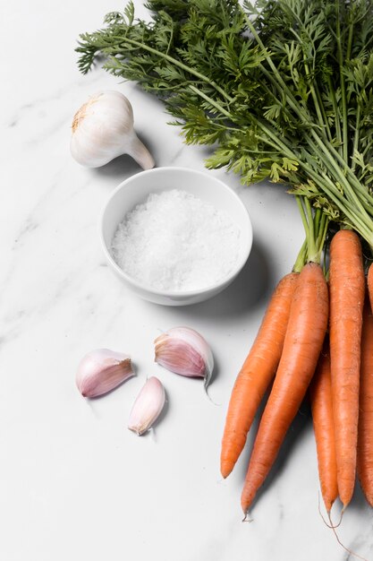 Flat lay carrots and and garlic arrangement