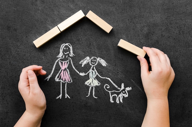 Free photo flat lay chalk drawing with single mom and daughter