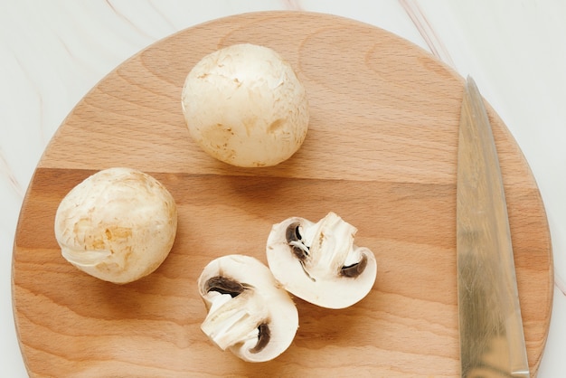 Free photo flat lay of champignon mushrooms