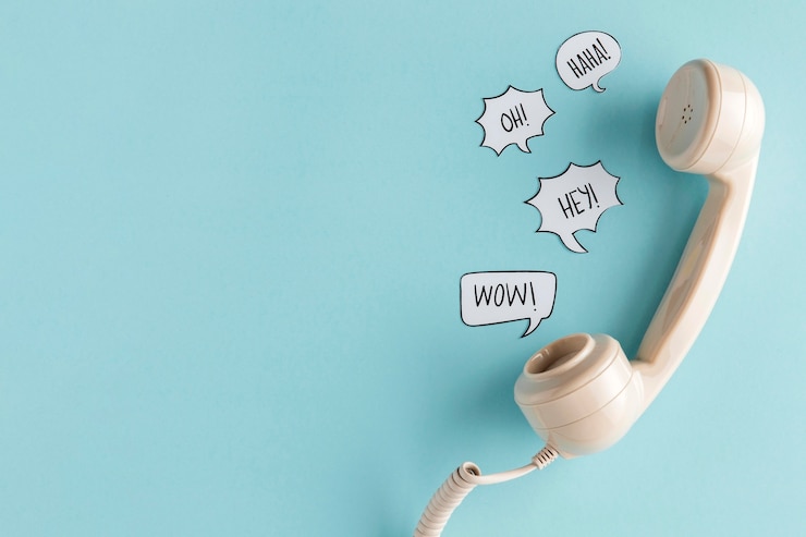 Free Photo flat lay of chat bubbles with telephone receiver and copy space